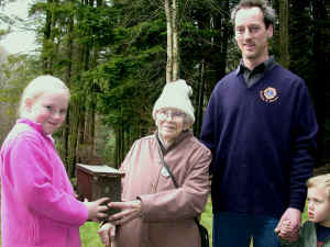 A Young Ranger donates one of the bird boxes to a local Senior Citizen.